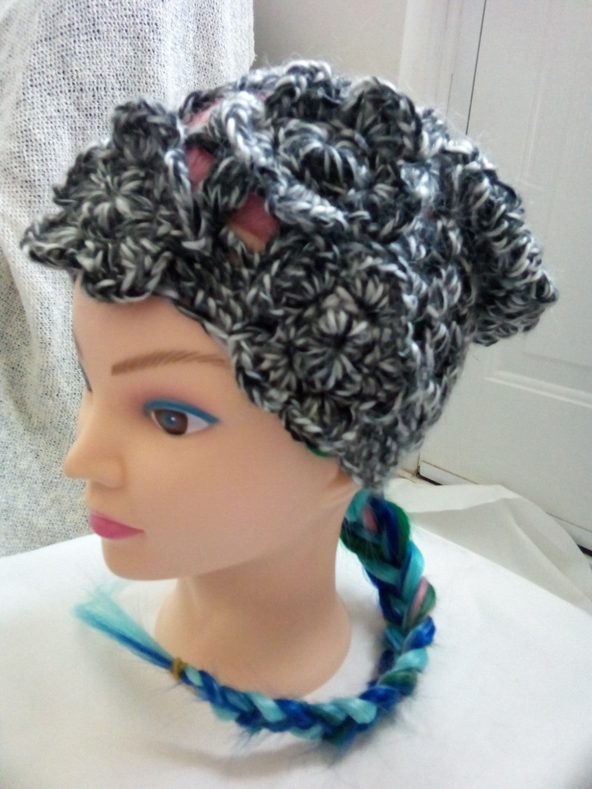 Black and white crochet slouch beanie hat with flower detail